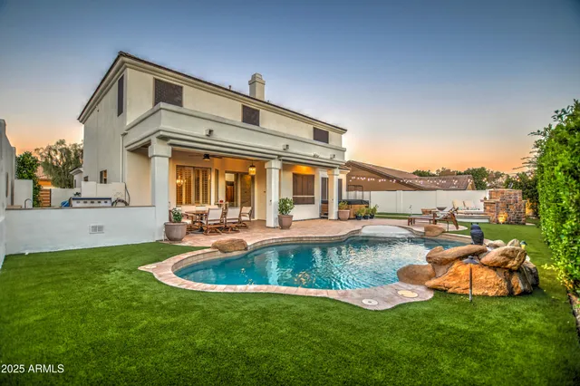 a view of a two chairs in the patio