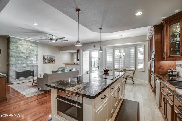 a living room with fireplace furniture and a flat screen tv