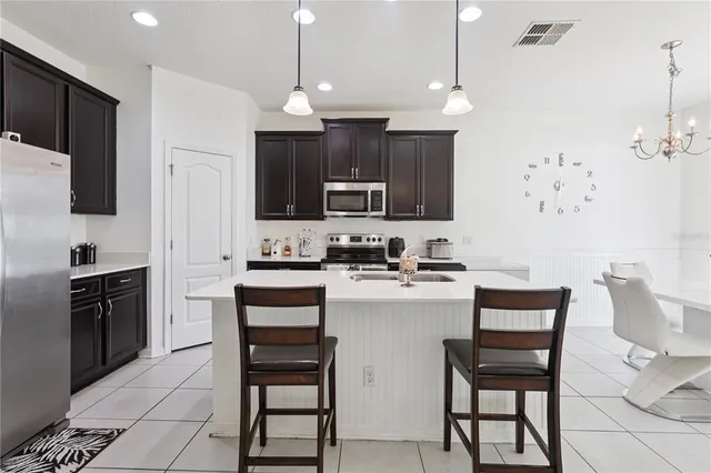 a bedroom with a bed and a dresser in it