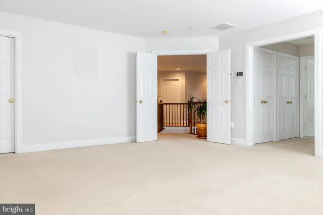 a view of a room with white walls