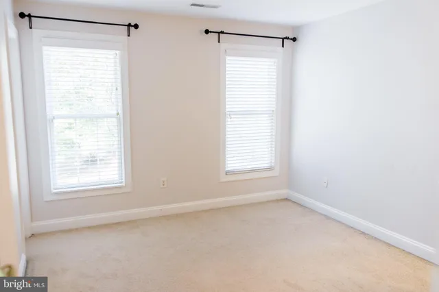 a bathroom with a shower curtain and a sink