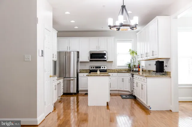 a view of an empty room with a fireplace
