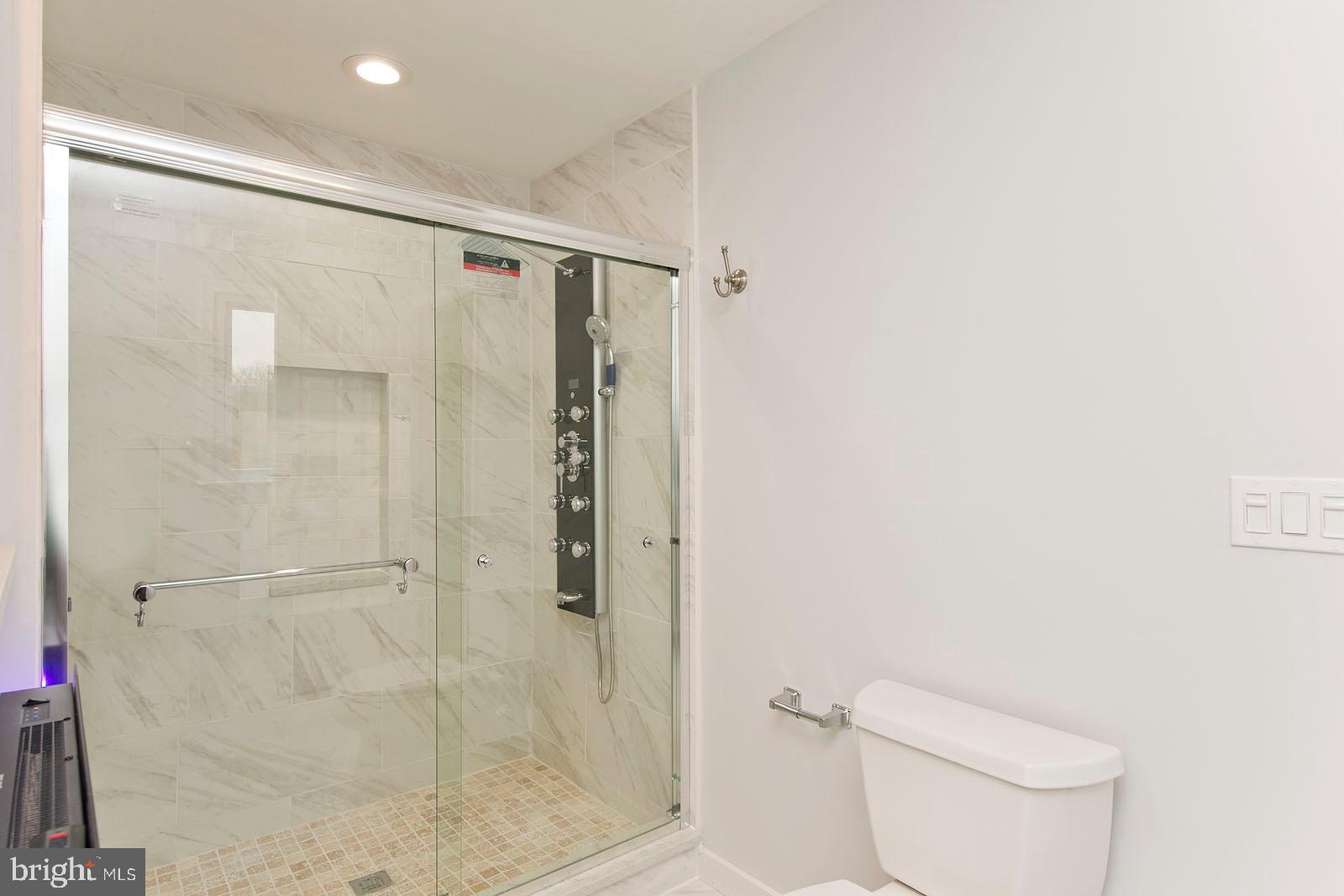 222 Springdale Road Winchester, VA 22602 - Photo 23 of 44 Multi-feature shower head. One touch flush toilet.