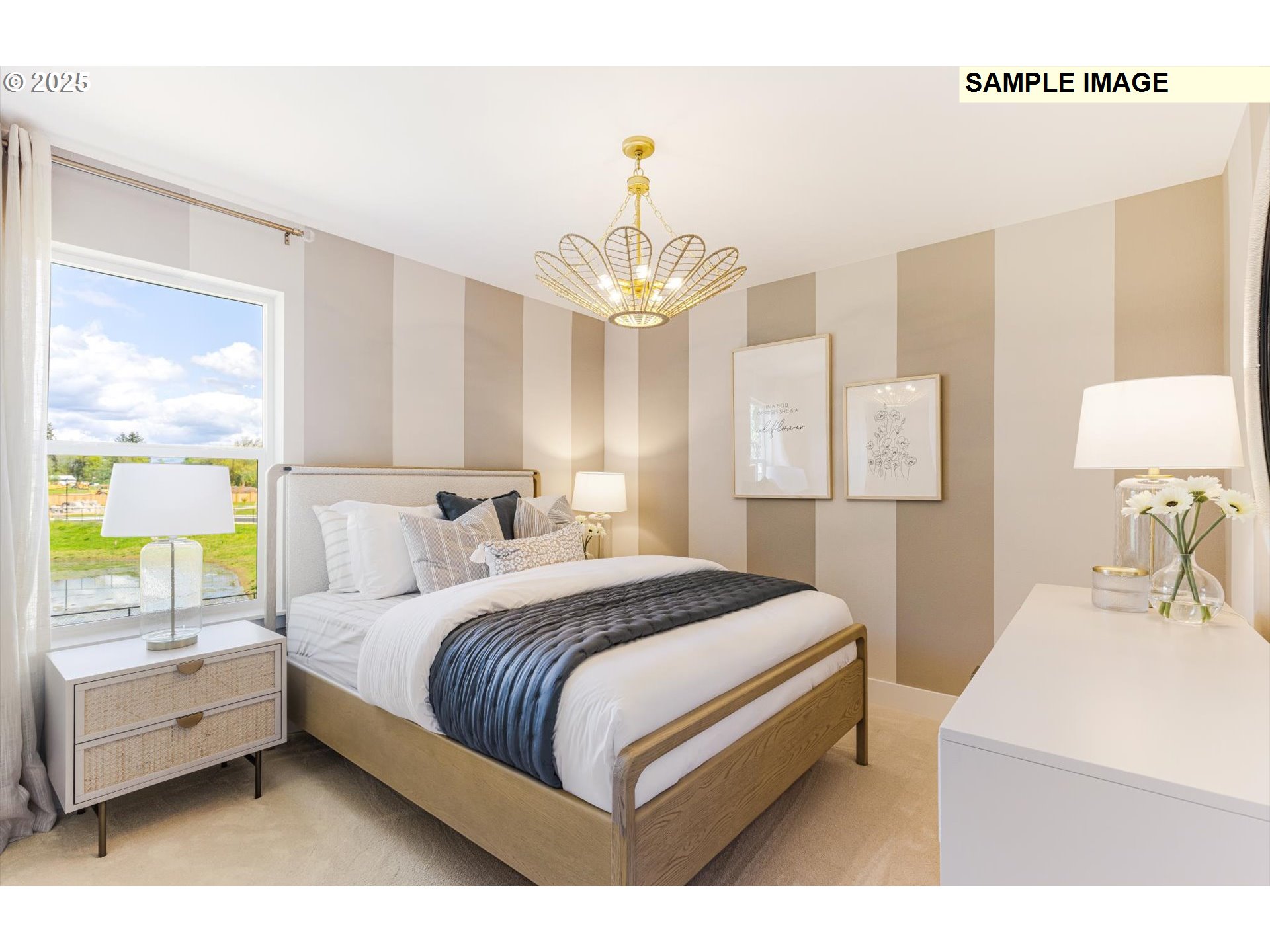 359 South 88th Avenue Ridgefield, WA 98642 - Photo 13 of 23 a bedroom with a bed and a chandelier