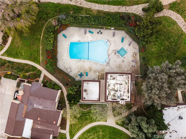 an aerial view of a house with a yard