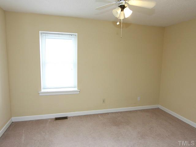 141 Jones Franklin Road Raleigh, NC 27606 - Photo 8 of 12 an empty room with a window