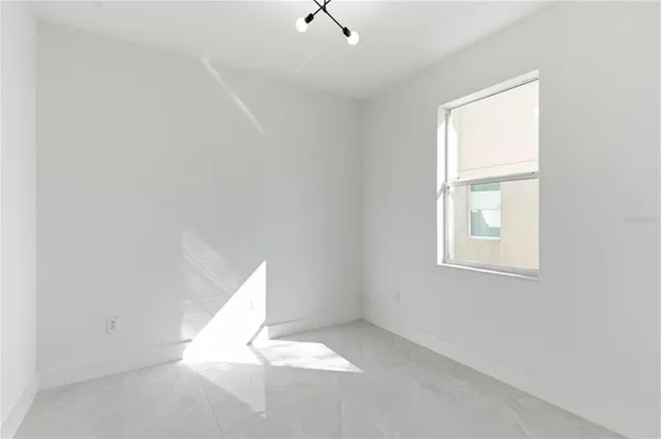a bathroom with a sink mirror and toilet
