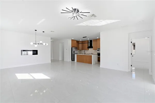 a kitchen with stainless steel appliances granite countertop a sink and stove