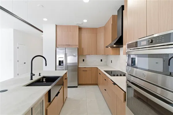 a view of a backyard with a garden and garage