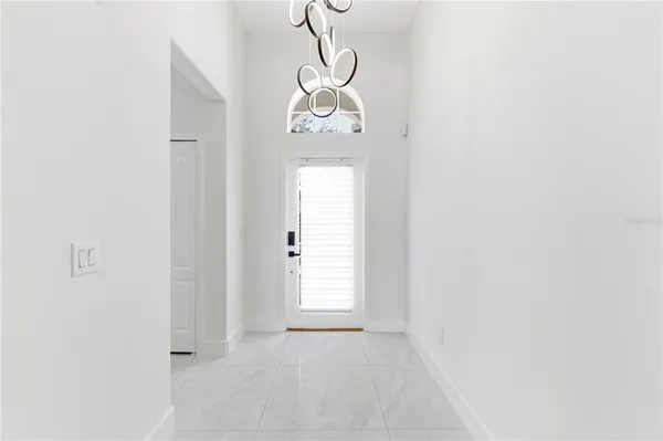 a view of a room with wooden floor and staircase