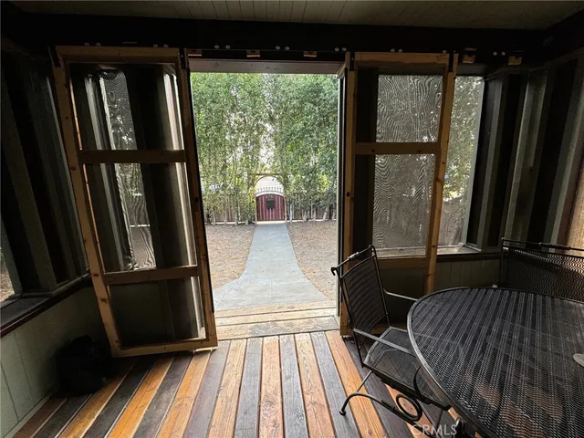 a view of a room that has a bed and a window