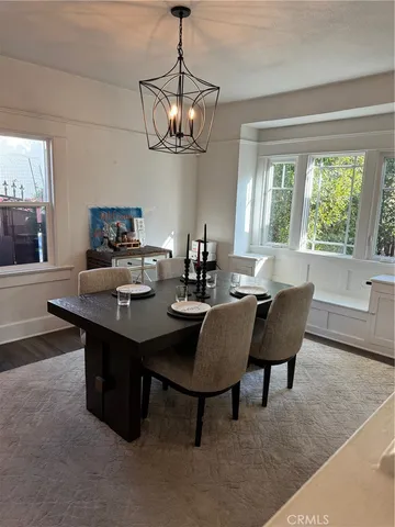 a bedroom with a bed and a ceiling fan