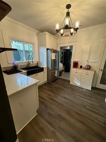 a dining room with furniture and wooden floor