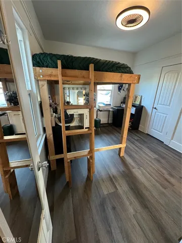 a bathroom with a sink mirror vanity and toilet