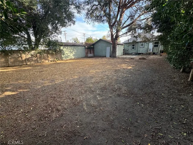an aerial view of residential houses with yard