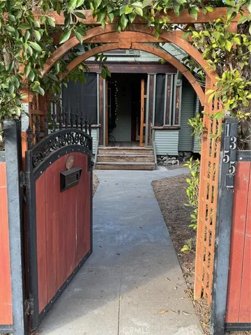 a front view of a house with a wooden fence
