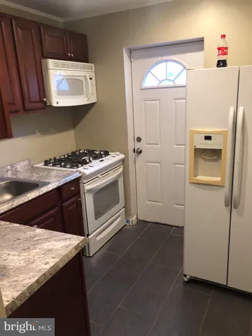a kitchen with a stove and a microwave
