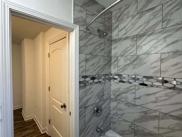 a view of a room with gym equipment and a large window