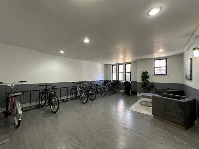 a room with a couch and a stove top oven