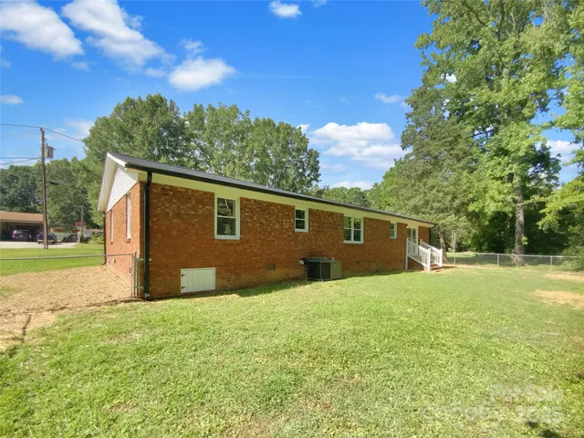 a backyard of a house with lots of green space