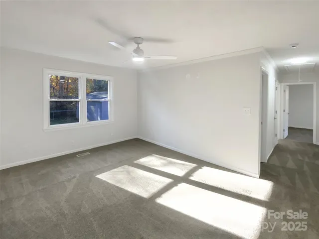 a view of an empty room and window