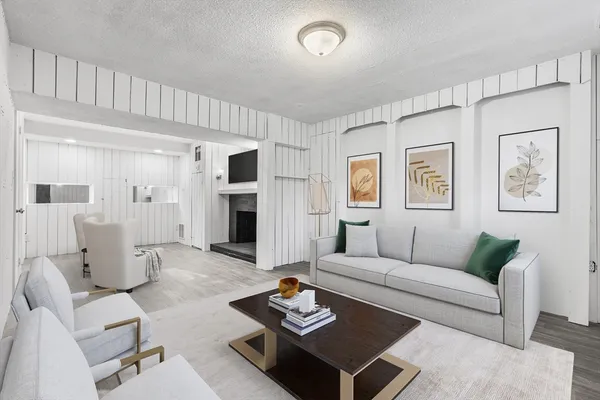 a living room with furniture and a table