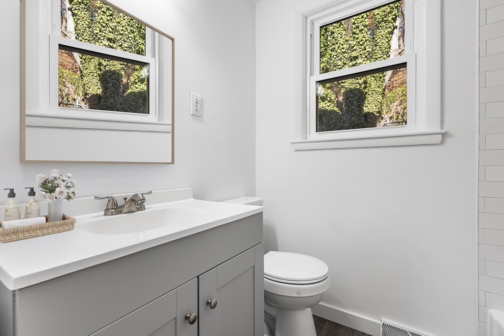 73 Lockwood Road Lynn, MA 01904 - Photo 5 of 10 a bathroom with a sink a toilet and a window