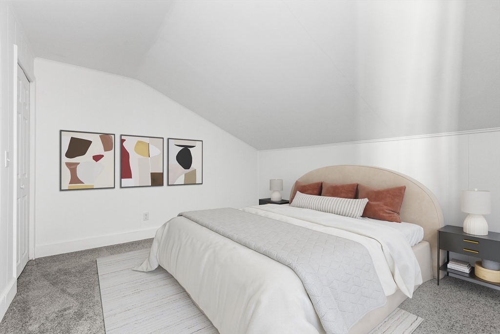 73 Lockwood Road Lynn, MA 01904 - Photo 8 of 10 a bedroom with a bed and lamp