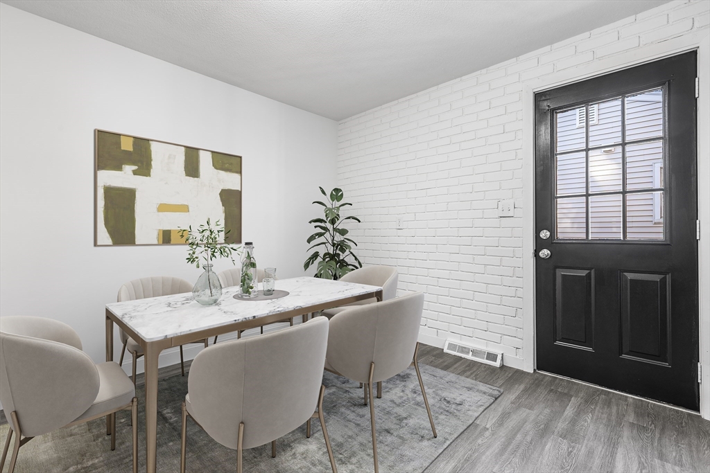 73 Lockwood Road Lynn, MA 01904 - Photo 9 of 10 a dining room with furniture and wooden floor