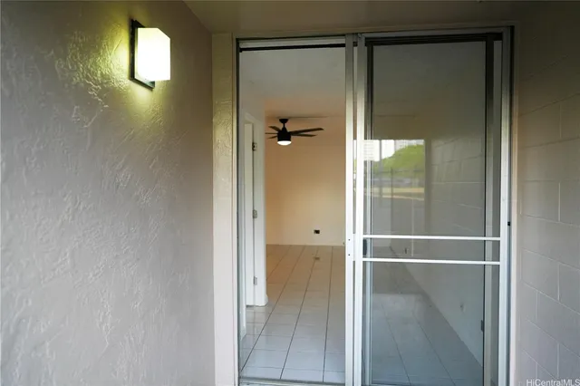 a bathroom with a glass shower door