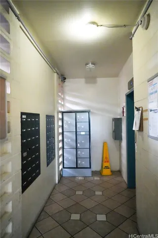 a view of a house with a backyard and a car parked