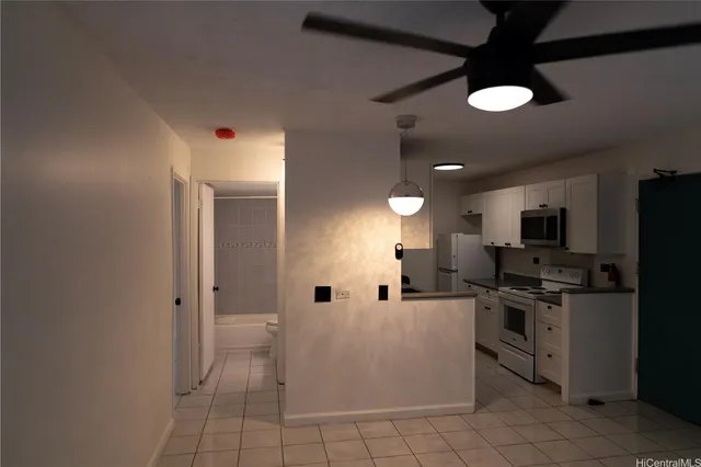 a kitchen with a sink stainless steel appliances and cabinets