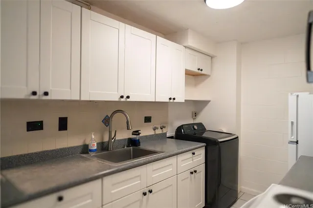 a kitchen with a sink and cabinets