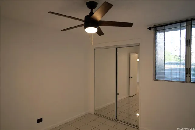 a bathroom with a shower and a window