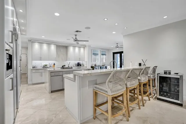 a kitchen with a sink cabinets and window