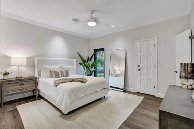 a spacious bedroom with a bed and a couch