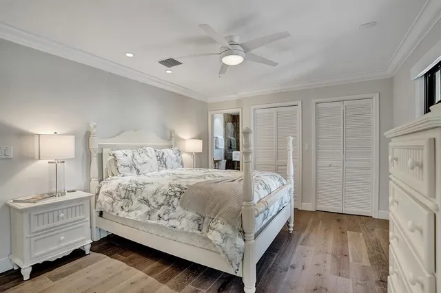 a bedroom with a bed and large window