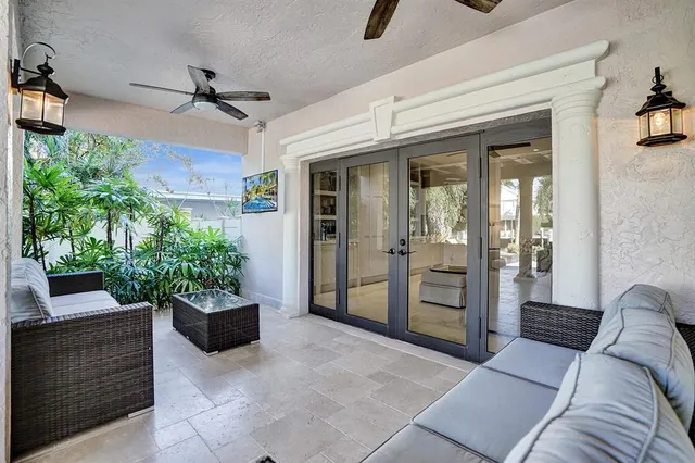 a view of a patio with a table and chairs