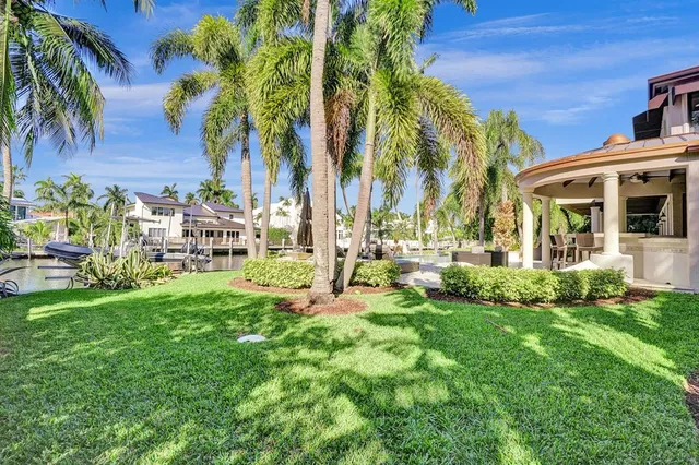 a view of a house with backyard porch and sitting area