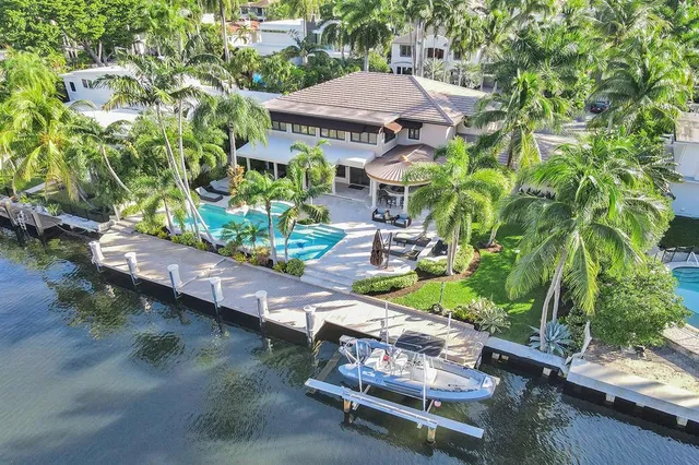 a backyard of a house with outdoor seating
