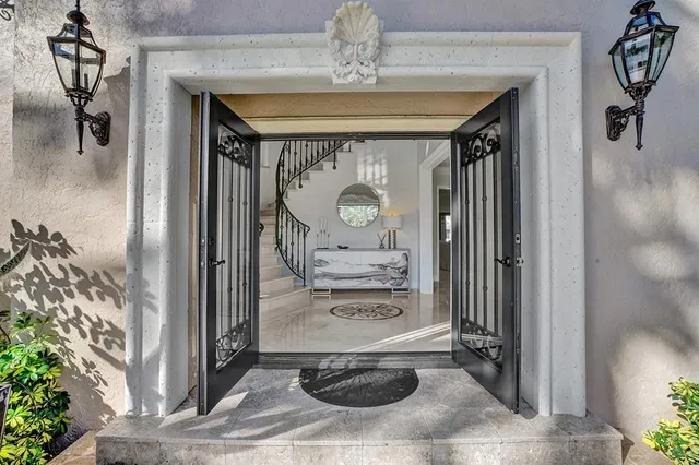 a view of entryway a livingroom and hall with wooden floor