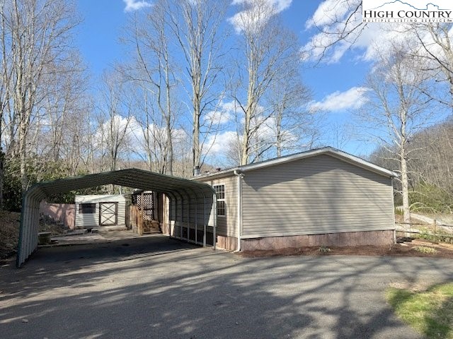 68 Rhoneys View Road Newland, NC 28657 - Photo 10 of 37 a front view of a house with a yard and garage