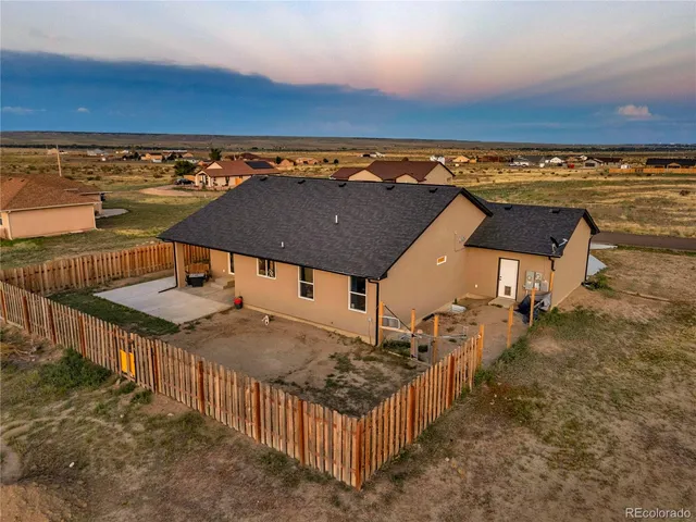 a view of a terrace with outdoor seating and city view