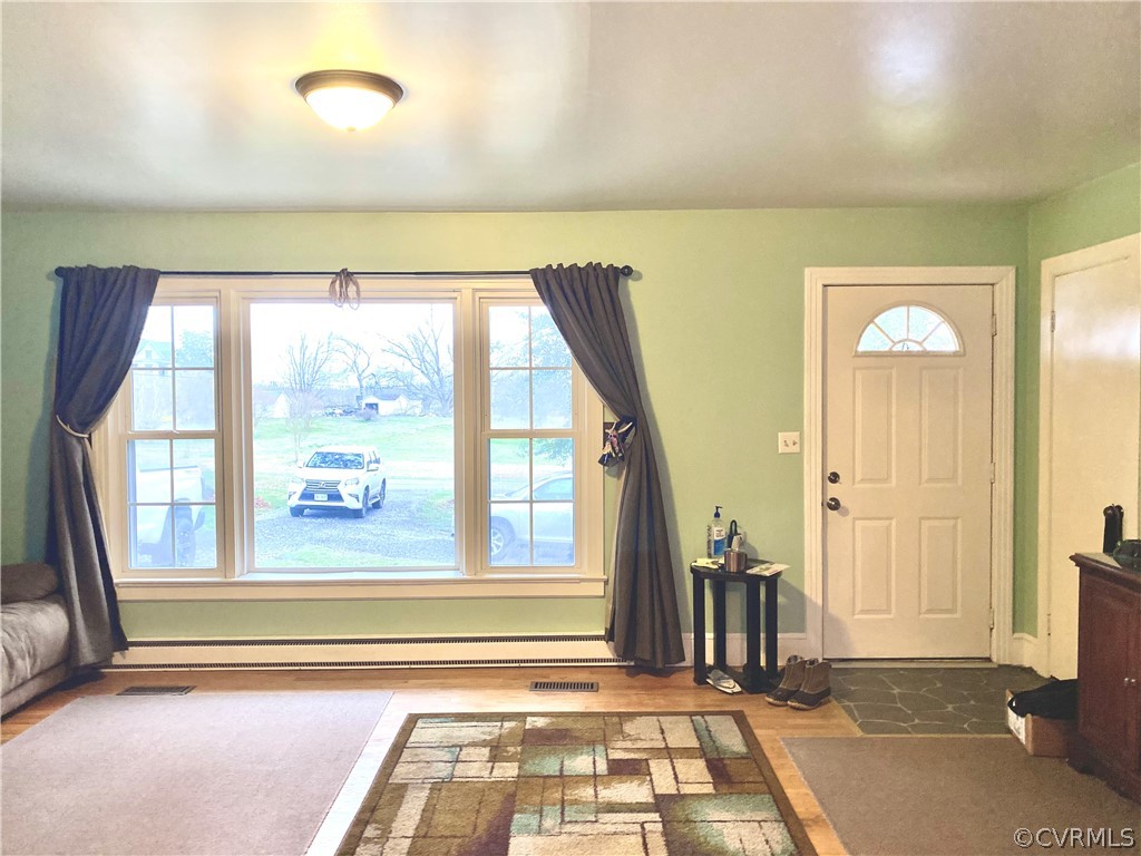 2825 Blackstone Road Kenbridge, VA 23944 - Photo 3 of 20 a view of a entryway door with furniture and floor to ceiling window
