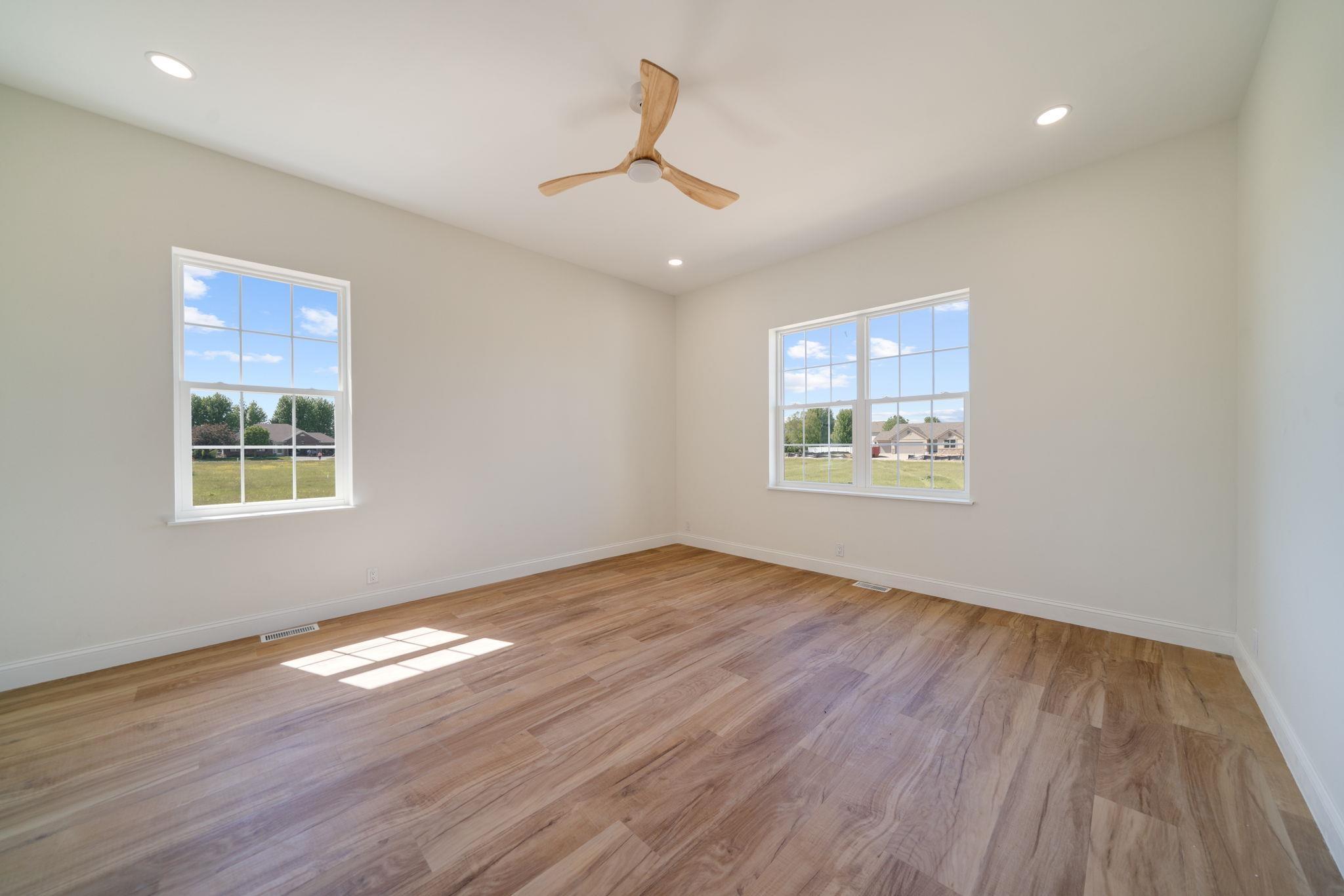 5145 Sycamore Ridge Road Belvidere, IL 61008 - Photo 22 of 57 a view of an empty room with wooden floor and a window