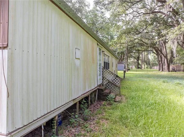 a house view with a backyard space