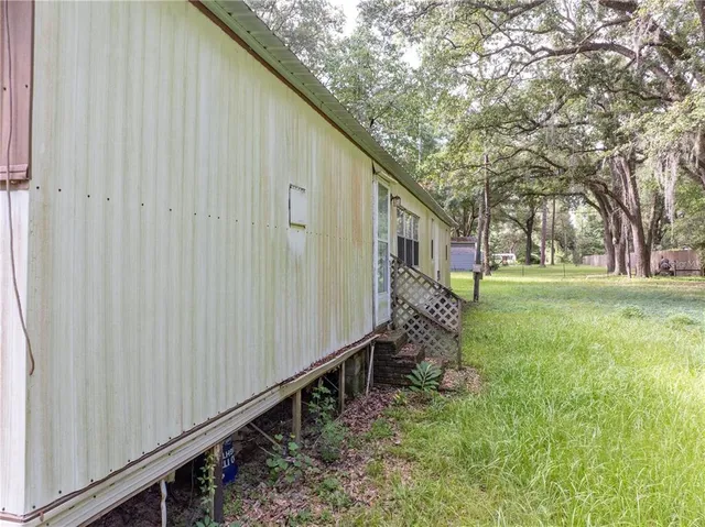 a house view with a backyard space