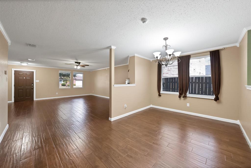 4021 German Pointer Way Fort Worth, TX 76123 - Photo 15 of 38 a view of an empty room with wooden floor and a window