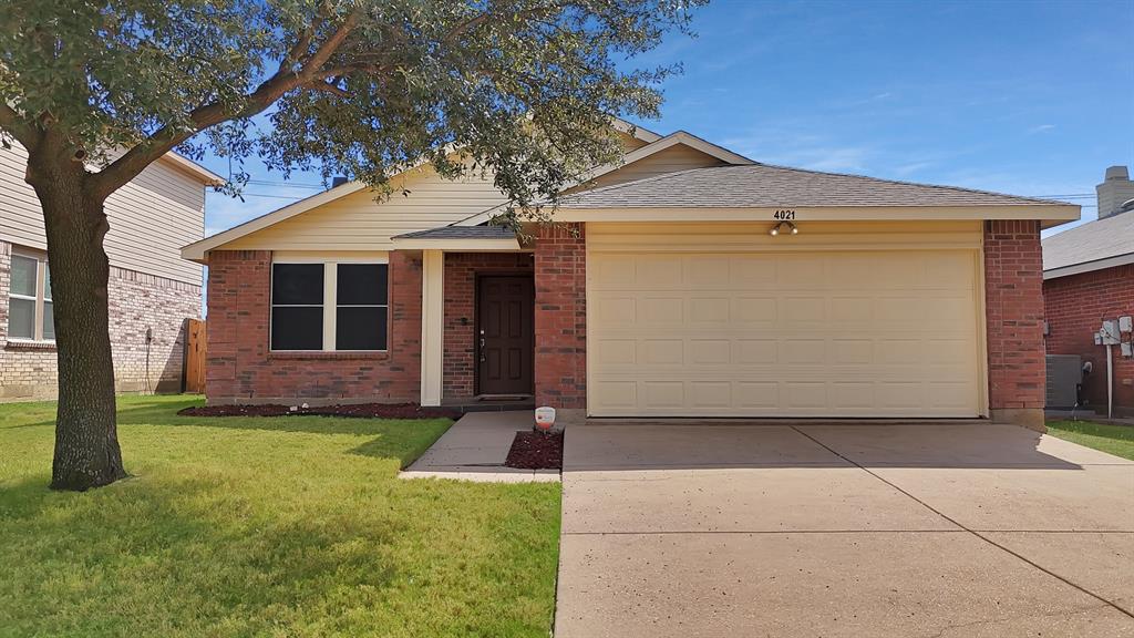 4021 German Pointer Way Fort Worth, TX 76123 - Photo 2 of 38 a front view of a house with a yard and garage