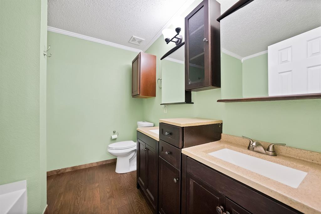 4021 German Pointer Way Fort Worth, TX 76123 - Photo 30 of 38 a bathroom with a toilet sink and mirror